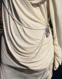 White With Draped Pearls And Shoulder And Hip Brochee