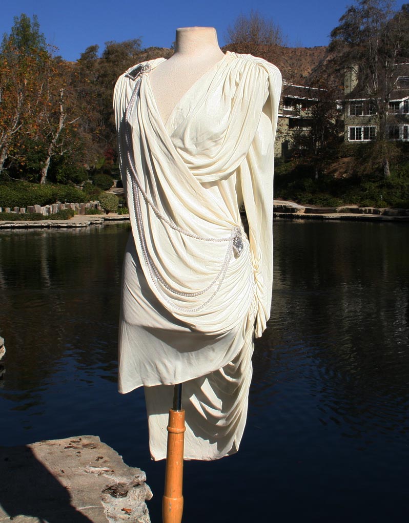 White With Draped Pearls And Shoulder And Hip Brochee